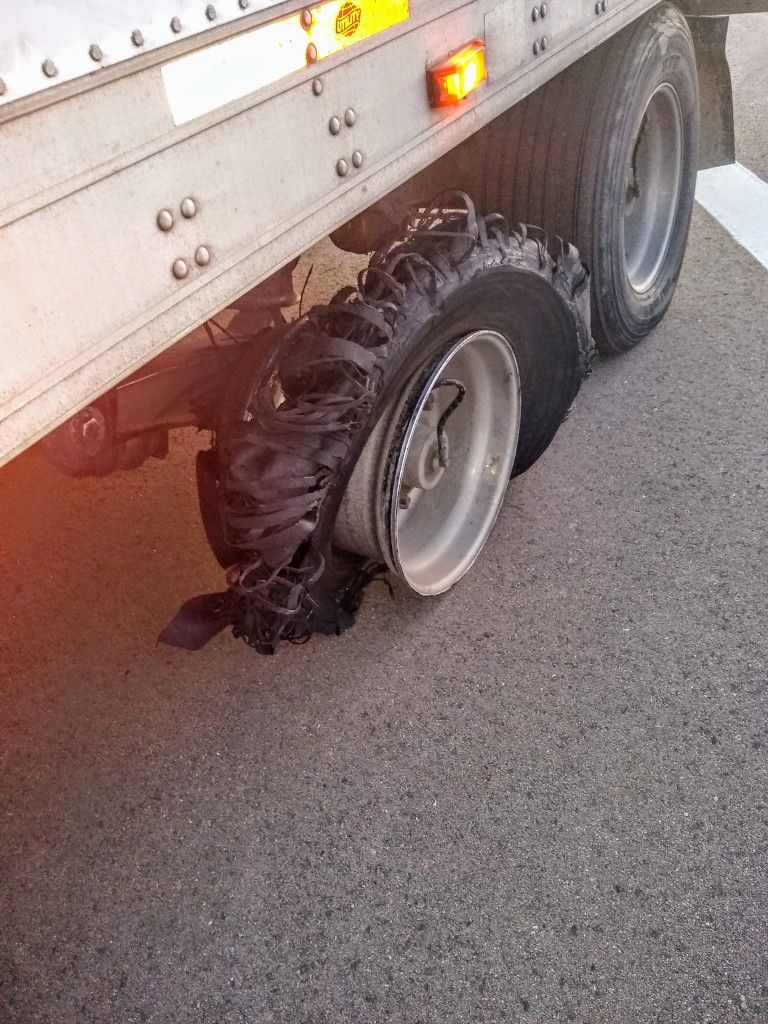 Shredded tire on a truck at the roadside